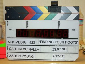 A photo of a clapboard that is with the Finding Your Roots episode.